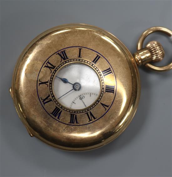 A 1920s JW Benson 9ct gold keyless half hunter pocket watch.